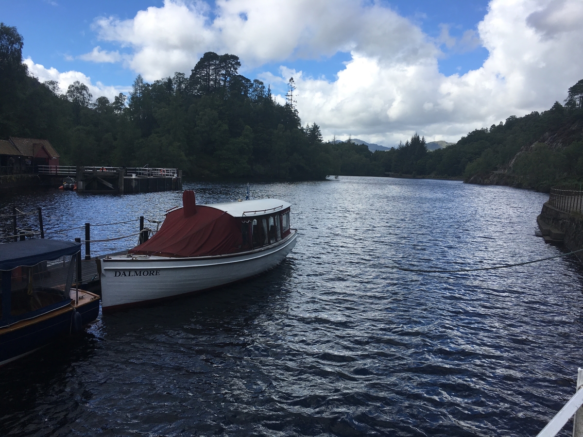 A boat sitting on a waterway in Scotland.